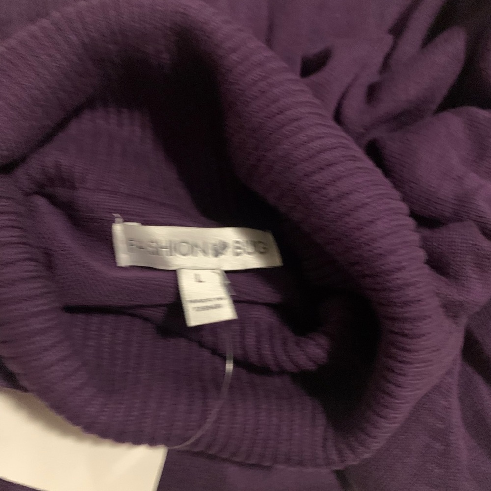 Turtle neck purple new with tags with nice button details at bottom of sleeves